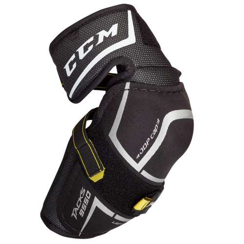 CCM Tacks 9550 junior elbow pads. The pads are black, white and yellow with a CCM logo.